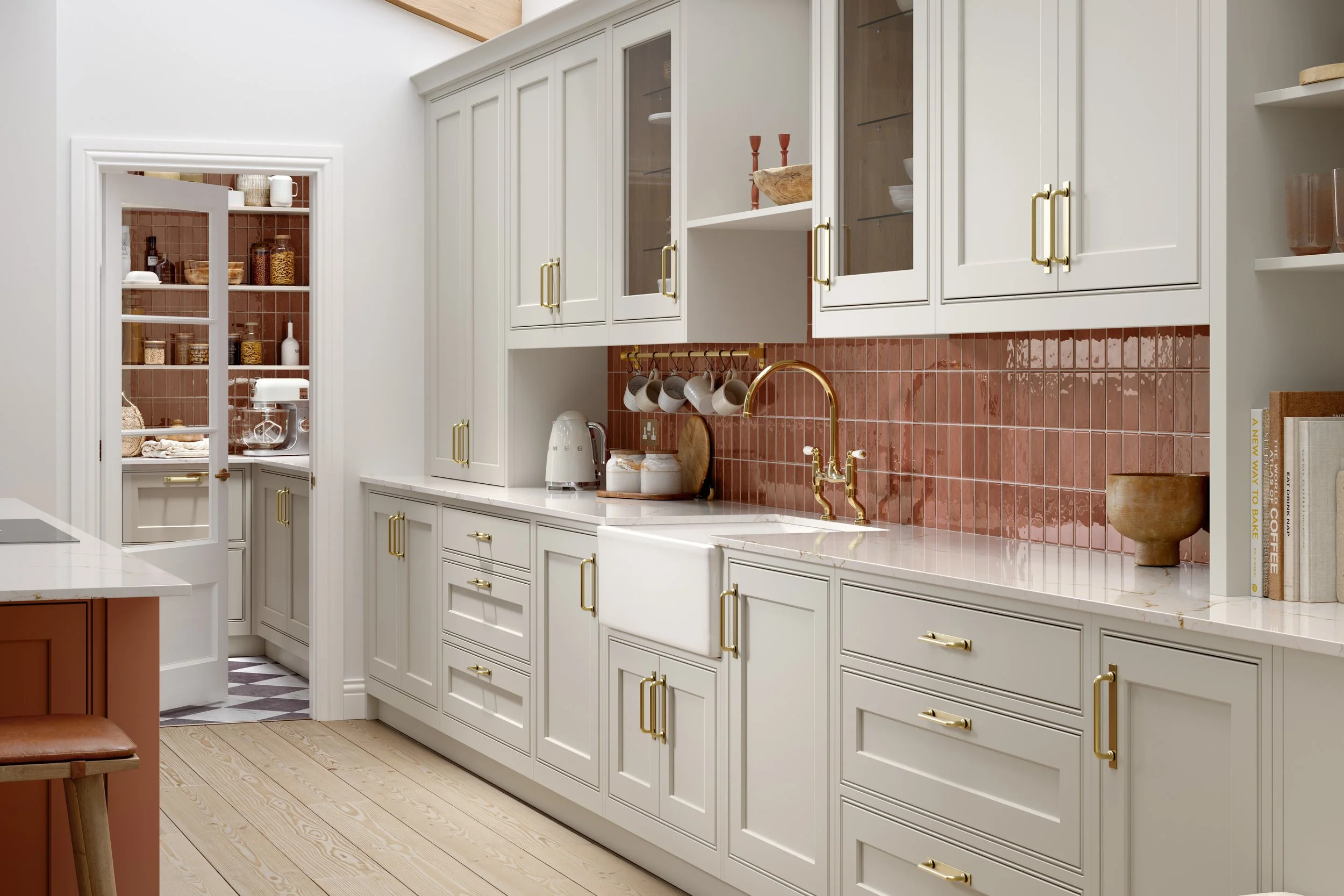 Omega Heritage Collection Sienna door in painted Limestone with antique brass cup pulls, Belfast farmhouse sink, polished brass swan-neck tap and a terracotta-fluted-tile splashback; supplier image of a door style Oriel stocks